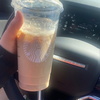 Starbucks - a hand holding a cup of iced coffee - Coffee & Tea Near Me - Orland Park, Illinois