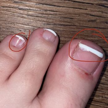 Nirvana Beauty Lounge - Smudged polish on big and little toe - Nail Salons Near Me - Reno, Nevada