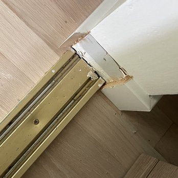 Uniq Floors - Incorrectly installed baseboards around closet track - Flooring Near Me