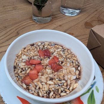Kin Khao - BLACK RICE PUDDING  STRAWBERRY, SWEET+SALTY COCONUT CREAM, CRISPY RICE+PEANUT+SESAME PRALINE - Thai Near Me - San Francisco, California