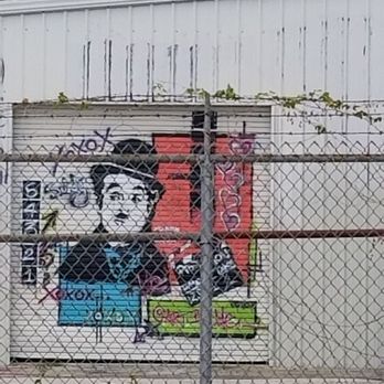 WestArt District - Free Charlie Chaplin! Liberate the White Walls! Mr. Gorbachev, tear down this barbed wire fence! - Local Flavor Near Me - Orlando, Florida WestArt District - Free Charlie Chaplin! Liberate the White Walls! Mr. Gorbachev, tear down this barbed wire fence! - Local Flavor Near Me - Orlando, Florida