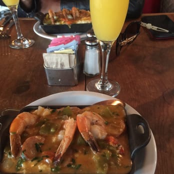Corner Social - Shrimp and grits with a complimentary mimosa. - New American Near Me - New York, New York