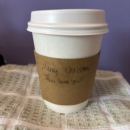 Small whole milk CAFFE LATTE 12 OZ with a handwritten religious message that I did not expect.