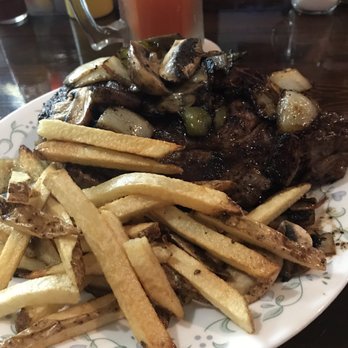 Idle-A-While - ows a plate of french fries and steak - Bars Near Me - Cherokee, Kansas