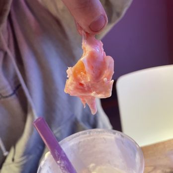 Moge Tee DC - a person holding a piece of food - Bubble Tea Near Me - Washington, DC, District of Columbia