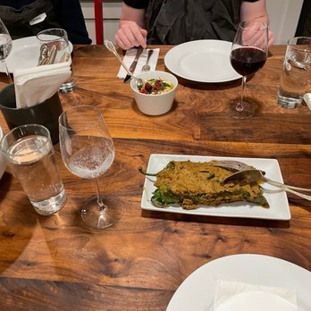 The Pantry - a wooden table with plates of food and glasses of wine - Specialty Food Near Me - Seattle, Washington The Pantry - a wooden table with plates of food and glasses of wine - Specialty Food Near Me - Seattle, Washington