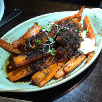 River Roast - "Carrots and Dirt" possibly one of the best side dishes I've ever had. Grilled and topped with pumpernickel crumbs, goat cheese and balsamic - American Near Me - Chicago, Illinois