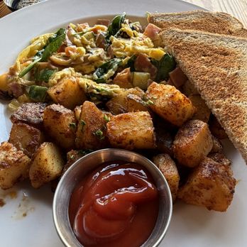 Fog City Cafe - The Scrambled with Ham and Cheddar, potatoes (nicely spiced), wheat toast. - Coffee & Tea Near Me - Daly City, California Fog City Cafe - The Scrambled with Ham and Cheddar, potatoes (nicely spiced), wheat toast. - Coffee & Tea Near Me - Daly City, California