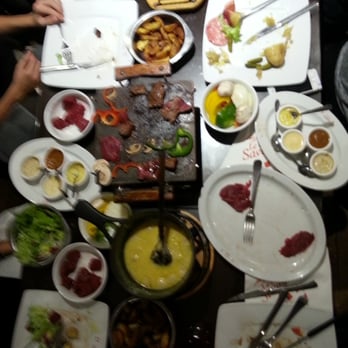 Le Chalet Savoyard - A great evening with a table full of raclette, steak and everything else. - Fondue Near Me - Paris, 75