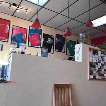 Boba Zone - a dining area with pictures on the wall - Coffee & Tea Near Me - Wichita, Kansas