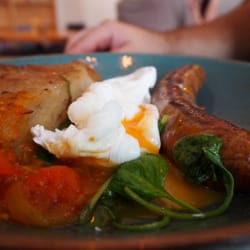 Caramelised onion and potato hash, merguez sausage, poached egg, tomato relish