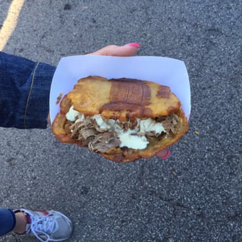 Oaktoberfest - Patacon - Green plantain sandwich with pork $5 - Local Flavor Near Me Oaktoberfest - Patacon - Green plantain sandwich with pork $5 - Local Flavor Near Me