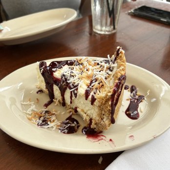 Coconuts - Delicious coconut cheesecake topped with raspberry drizzle! This was light not too sweet and absolutely delightful - Seafood Near Me - Fort Lauderdale, Florida