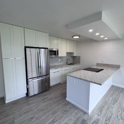 Amcor Construction - Renovate the cabinets, countertops, flooring, and bathroom.