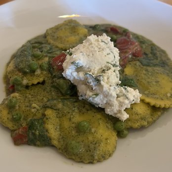 Mythos Restaurant - Spinach and Garlic Ravioli(V)- $22 Davina tomatoes, sweet peas, herb whipped ricotta, basil pesto cream sauce - New American Near Me - Orlando, Florida Mythos Restaurant - Spinach and Garlic Ravioli(V)- $22 Davina tomatoes, sweet peas, herb whipped ricotta, basil pesto cream sauce - New American Near Me - Orlando, Florida