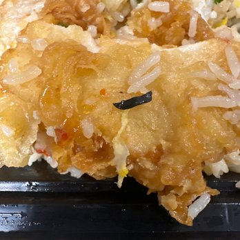 Osha Thai Express - Black plastic object on the crispy chicken. - Thai Near Me - Oakland, California