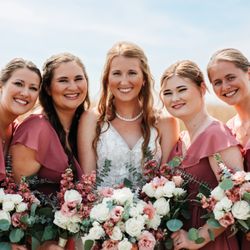 Drummers Garden Center & Floral - Brides and Bridesmaids holding wedding bouquets of dusty rose and white flowers.