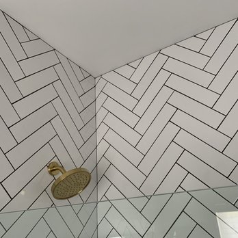 GM Elite Tile & Stone Installation - Herringbone pattern - pattern perfectly continues around corner and perfect grout line at ceiling - Tiling Near Me GM Elite Tile & Stone Installation - Herringbone pattern - pattern perfectly continues around corner and perfect grout line at ceiling - Tiling Near Me