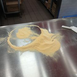 Pile of leftover corn meal after the pizza maker finished. It's like spotting a pizza ghost!