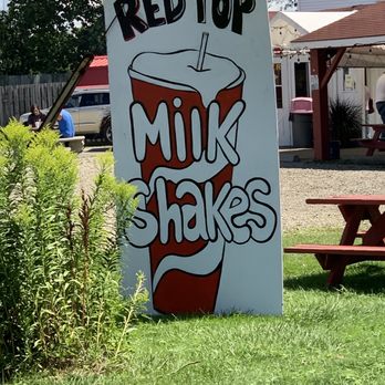 Red Top - a sign for milk shakes in front of a picnic table - Hot Dogs Near Me - Hamburg, New York
