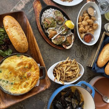 A'Bouzy - Seafood pot pie, baked oysters, Cajun popcorn shrimp, fries and mussels - Champagne Bars Near Me - Houston, Texas A'Bouzy - Seafood pot pie, baked oysters, Cajun popcorn shrimp, fries and mussels - Champagne Bars Near Me - Houston, Texas