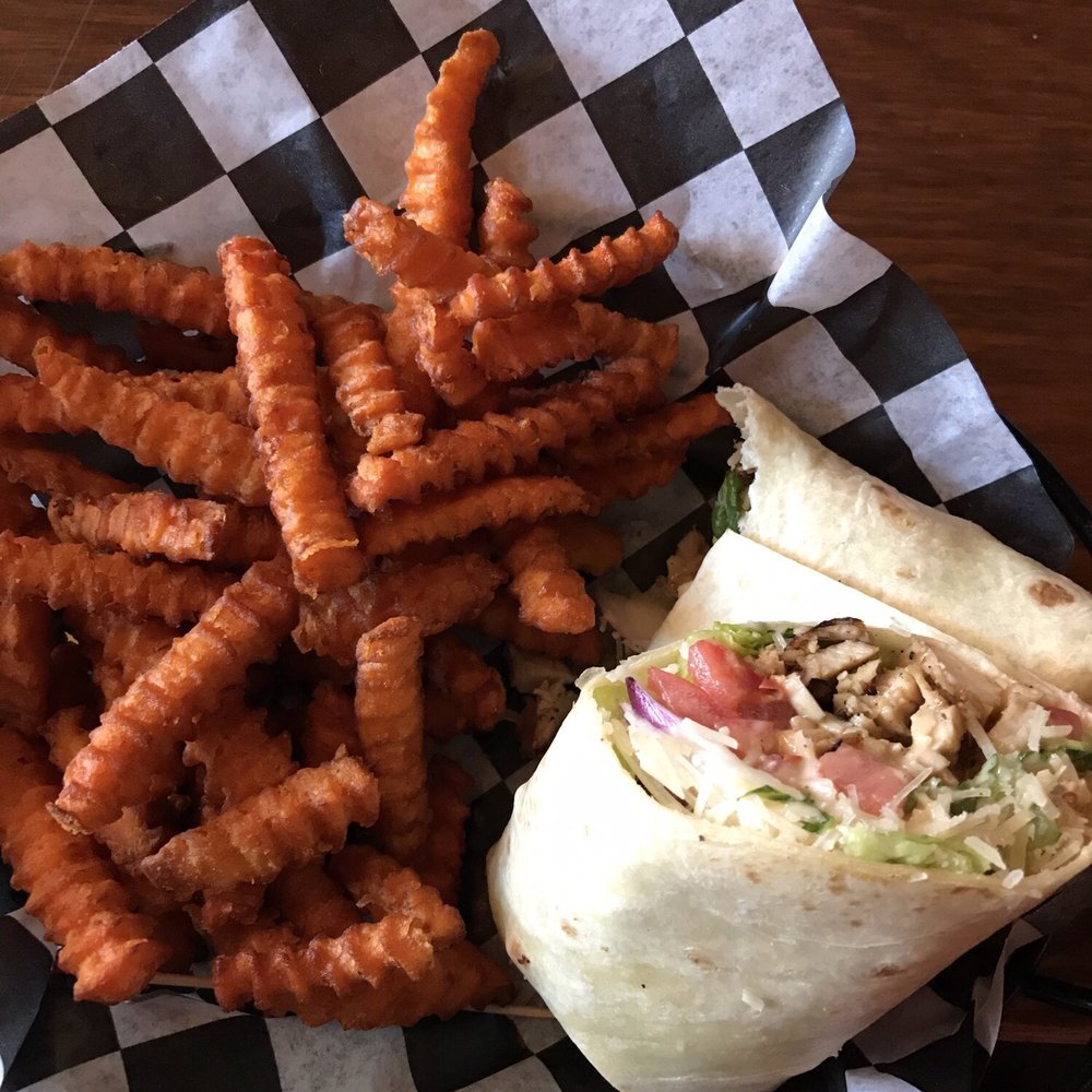 Hell's Kitchen - Chicken Caesar wrap and sweet potato fries - American Near Me - Wilmington, North Carolina Hell's Kitchen - Chicken Caesar wrap and sweet potato fries - American Near Me - Wilmington, North Carolina