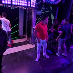 Caudillos Disco Bar - A tranny gets punched to the floor, dragged towards the stairs & hit with a stool while the guards just looked at her on the floor.
