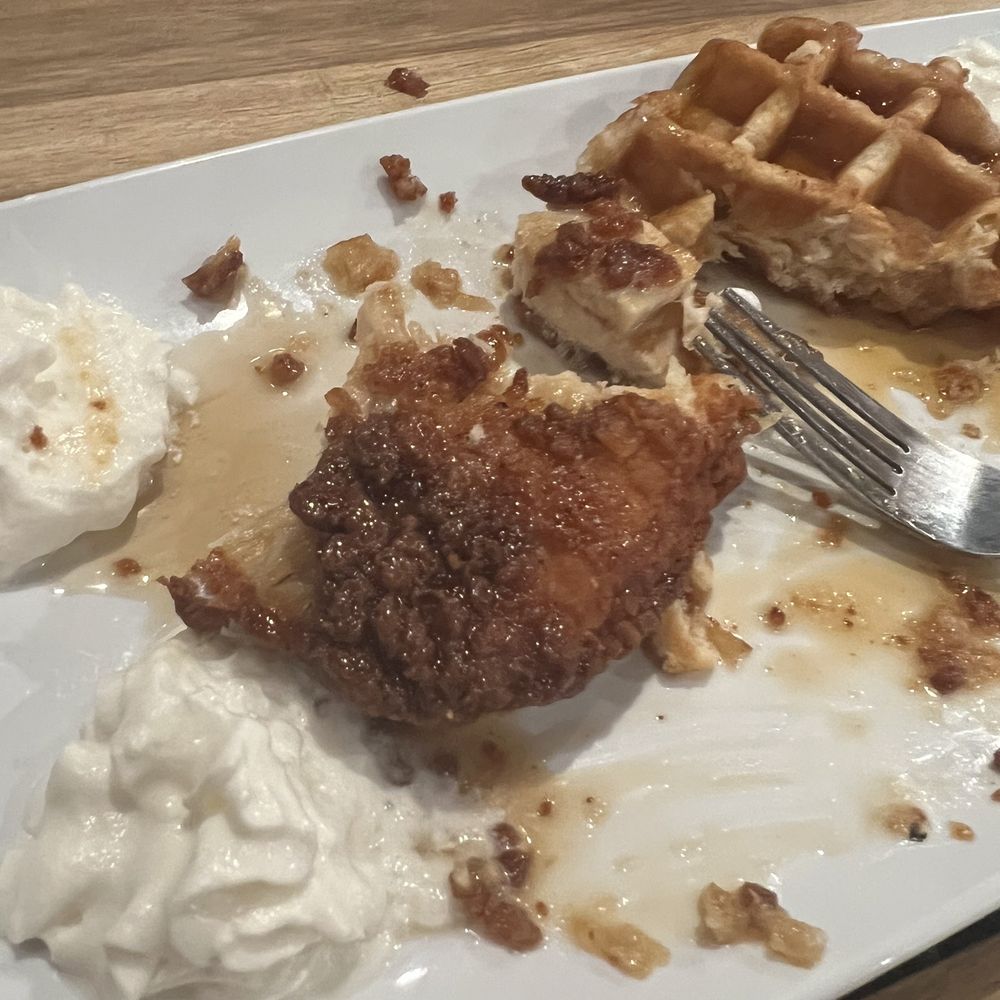 Chicken & Waffle with maple syrup and whipped cream Chicken & Waffle with maple syrup and whipped cream