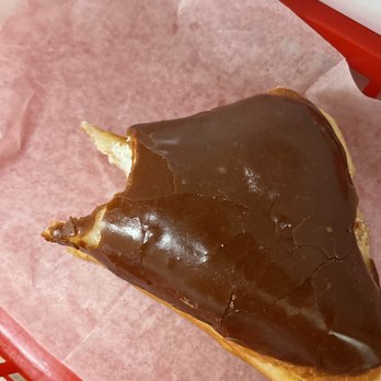 Donut Kitchen - a half eaten donut in a basket - Donuts Near Me - Marysville, California