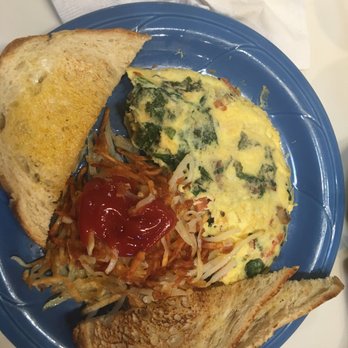 The Griddle - Spinach-feta-basil-tomato (added mushrooms) omelette, hash browns and Sourdough toast - Breakfast & Brunch Near Me - Meridian, Idaho