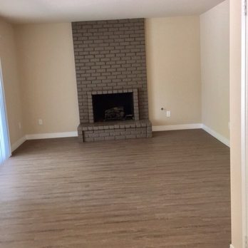 Hassle Free Painting - Freshly painted Fireplace and walls matches nicely with our new flooring! - Painters Near Me