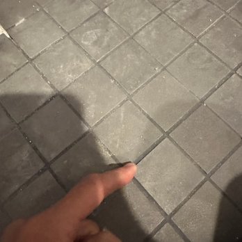 J & Z Handyman - Uneven tile, edges and corners poking up.. feel bad for toes in the shower.. - General Contractors Near Me