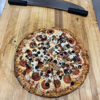 Jack's Legacy KN - a pizza with pepperoni, olives, and cheese - Pizza Near Me - Knob Noster, Missouri