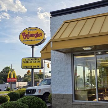 Bojangles - The architectural building design, with bright yellow awnings, under a beautiful blue sky. - Southern Near Me - Vinton, Virginia