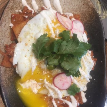 Scratch Kitchen - Chilaquiles. Not soggy. Delicious. Chicken, fried egg, mildly spicy sauce. - Breakfast & Brunch Near Me - Honolulu, Hawaii