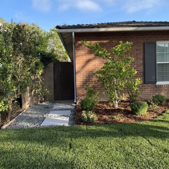 Hidden Gem Landscaping - Side of the house with gravel and pavers - Landscaping Near Me Hidden Gem Landscaping - Side of the house with gravel and pavers - Landscaping Near Me
