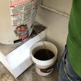 Plumbing Installs - A lot of Filthy sediment/water that was built up in the old water heater. Couldn't believe I was using water from this! - Plumbing Near Me Plumbing Installs - A lot of Filthy sediment/water that was built up in the old water heater. Couldn't believe I was using water from this! - Plumbing Near Me
