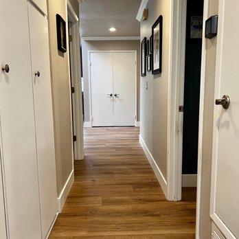 Unique Flooring - a narrow hallway with white cabinets - Flooring Near Me - Oceanside, California