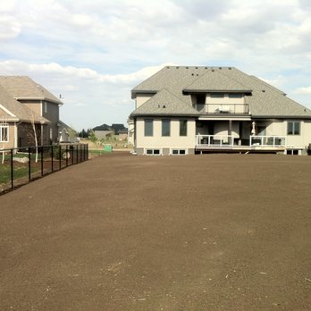 River Valley Final Grading - a large house with a deck - Landscaping Near Me - Edmonton, Alberta River Valley Final Grading - a large house with a deck - Landscaping Near Me - Edmonton, Alberta
