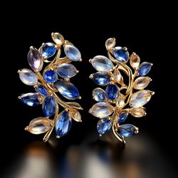 Brahim's Jewelry - Handcrafted sapphire leaf earrings -- Marquise-cut blue and violet sapphires set in warm yellow gold with delicate leaf-inspired design.