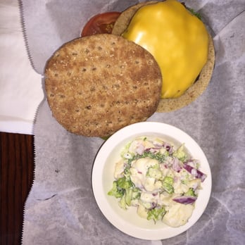 Trainwreck Saloon - Grass feed beef with American cheese on sheet flat bread with vege slaw. - Sports Bars Near Me - Saint Louis, Missouri Trainwreck Saloon - Grass feed beef with American cheese on sheet flat bread with vege slaw. - Sports Bars Near Me - Saint Louis, Missouri