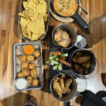 Topgolf - buffalo chicken dip w/ chips | chicken wings bone in (asian sesame, lemon pepper, garlic parmesan) | macaroni and cheese bites - Golf Near Me - Bridgeville, Pennsylvania Topgolf - buffalo chicken dip w/ chips | chicken wings bone in (asian sesame, lemon pepper, garlic parmesan) | macaroni and cheese bites - Golf Near Me - Bridgeville, Pennsylvania