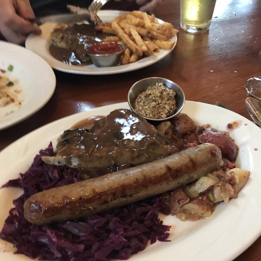 Vintage Restaurant - German Duo. Small schnitzel and wurst with German potato salad and red cabbage. - New American Near Me - Hermann, Missouri Vintage Restaurant - German Duo. Small schnitzel and wurst with German potato salad and red cabbage. - New American Near Me - Hermann, Missouri