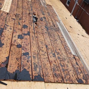Porterhouse Roofing and Construction - Hole in board - Roofing Near Me Porterhouse Roofing and Construction - Hole in board - Roofing Near Me