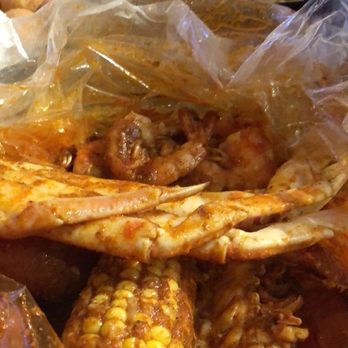 Mr and Mrs Crab - 1/2 lb shrimp, 1/2 lb crab, 1 lobster tail, corn, potatoes. Don't forget to add in a boiled egg and a order of hush puppies!! - Seafood Near Me - Brandon, Florida Mr and Mrs Crab - 1/2 lb shrimp, 1/2 lb crab, 1 lobster tail, corn, potatoes. Don't forget to add in a boiled egg and a order of hush puppies!! - Seafood Near Me - Brandon, Florida