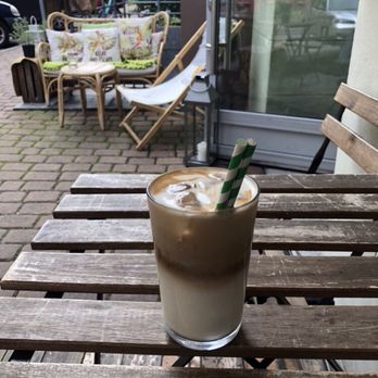 Botanika - Sipping iced coffee at an outside table - Breakfast & Brunch Near Me - Katowice, SL
