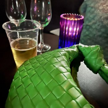 Quadz - a table with wine glasses and a bottle of beer - Gay Bars Near Me - Palm Springs, California Quadz - a table with wine glasses and a bottle of beer - Gay Bars Near Me - Palm Springs, California