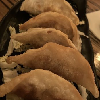 Tonkotsu Ramen Bar - Pork gyoza with a sesame ginger soy sauce to dip. - Ramen Near Me - West Valley City, Utah Tonkotsu Ramen Bar - Pork gyoza with a sesame ginger soy sauce to dip. - Ramen Near Me - West Valley City, Utah