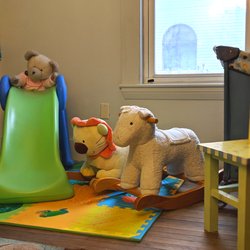 Wee Play Infant Toddler Development - Playroom with riders for different ages.