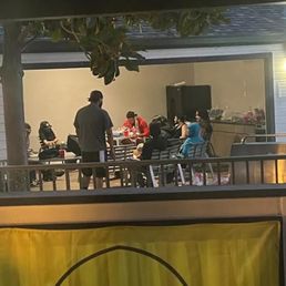 A large group of people with a giant bong and drinks at the pool after "closing time". A large group of people with a giant bong and drinks at the pool after "closing time".